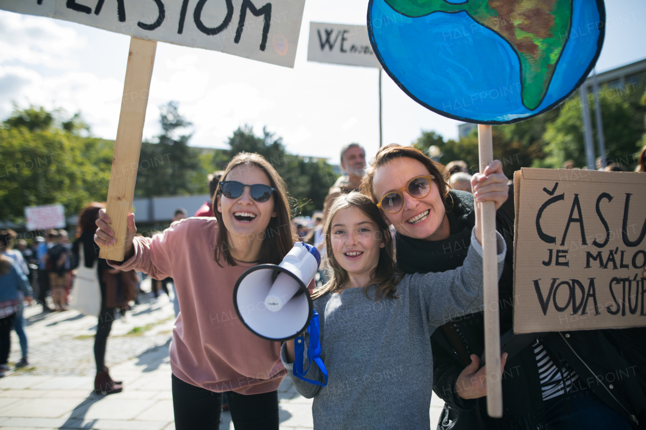 People with placards and amplifier on a global strike for climate change.