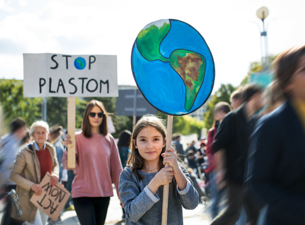 People with placards and posters on a global strike for climate change.