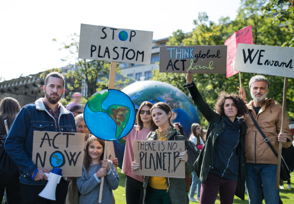 People with placards and posters on a global strike for climate change.