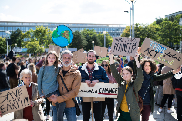 People with placards and posters on a global strike for climate change.