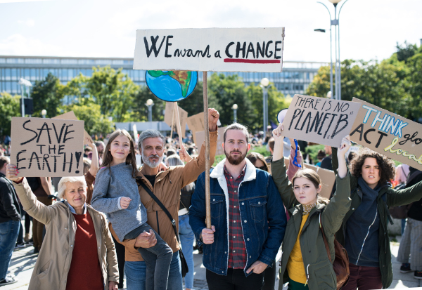 People with placards and posters on a global strike for climate change.