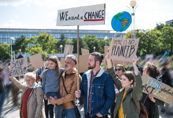 People with placards and posters on a global strike for climate change.