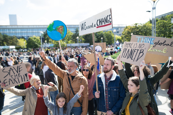 People with placards and posters on a global strike for climate change.