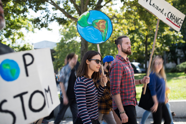 People with placards and posters on a global strike for climate change.