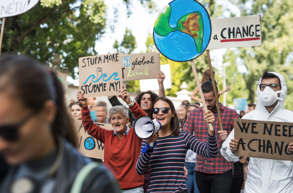 People with placards and amplifier on a global strike for climate change.