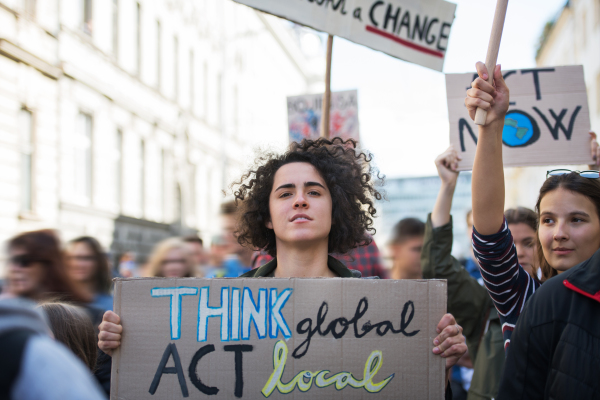 People with placards and posters on a global strike for climate change.