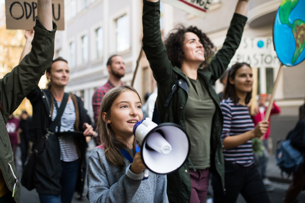 People with placards and amplifier on a global strike for climate change.