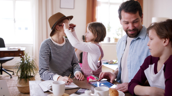 A beautiful family having breakfast before departing for vacation.