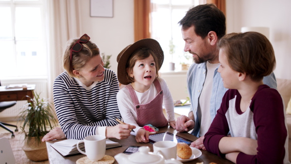 A beautiful family having breakfast before departing for vacation.