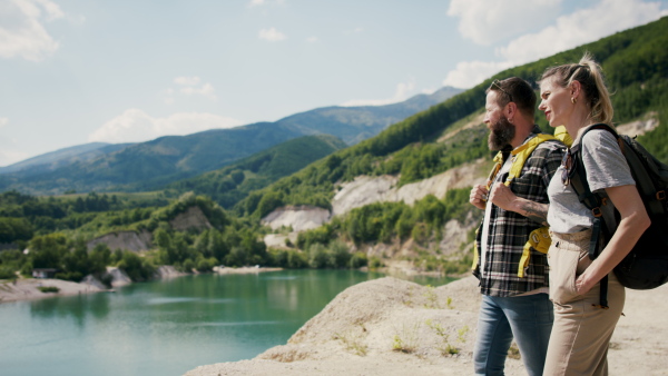 A happy mature couple in love hiking in nature.