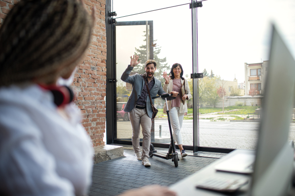 Young and old businesspeople working in an office, coworking and eco commuting concept.