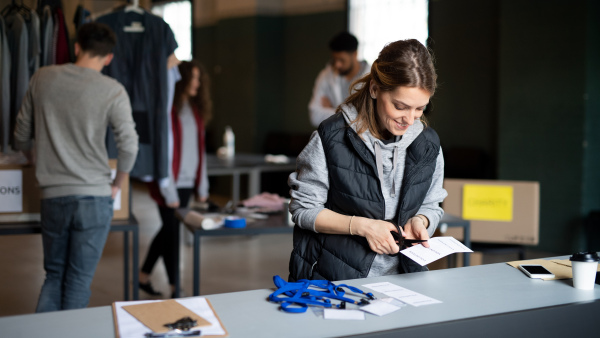 A group of volunteers working in community charity donation center.