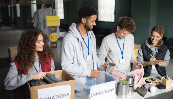 A group of volunteers working in community charity donation center.