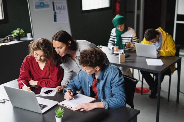 A group of people attending education class in community center.