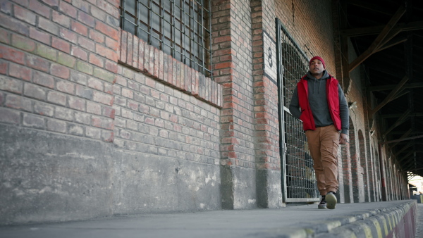 Two young men dealing drugs in the street, low angle view.