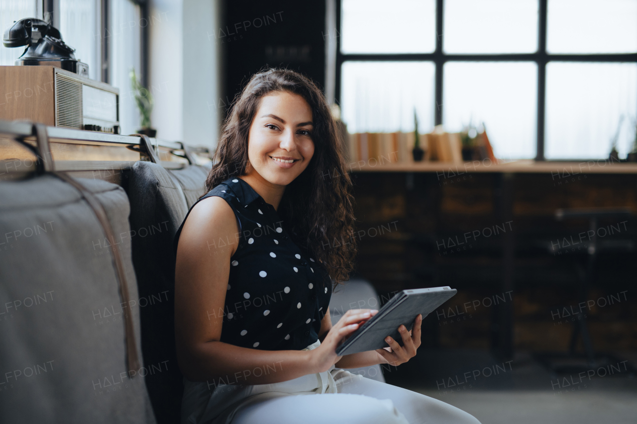 Universtiy student studying in coffee shop, prepraing for final exams at the end of semester. Businesswoman preparing for meeting, working on presentation on tablet, sitting in modern office.