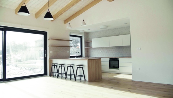 A modern interior of kitchen in a house or flat in new home. A moving in new home concept. Slow motion.