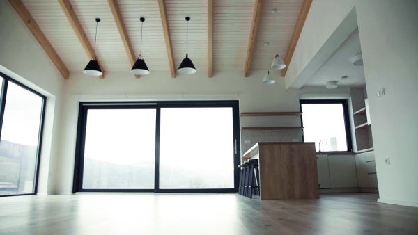 A modern interior of kitchen in a house or flat in new home. A moving in new home concept. Slow motion.