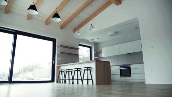 A modern interior of kitchen in a house or flat in new home. A moving in new home concept. Slow motion.