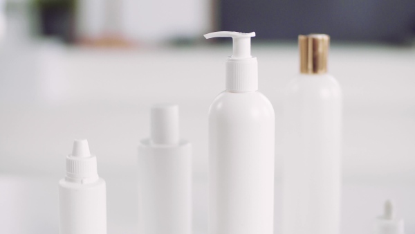 A close-up of beauty products on the desk.