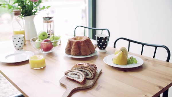 A table set for breakfast indoors at home. Slow motion.