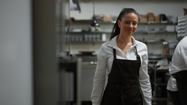 A chef using combi oven in restaurant kitchen.