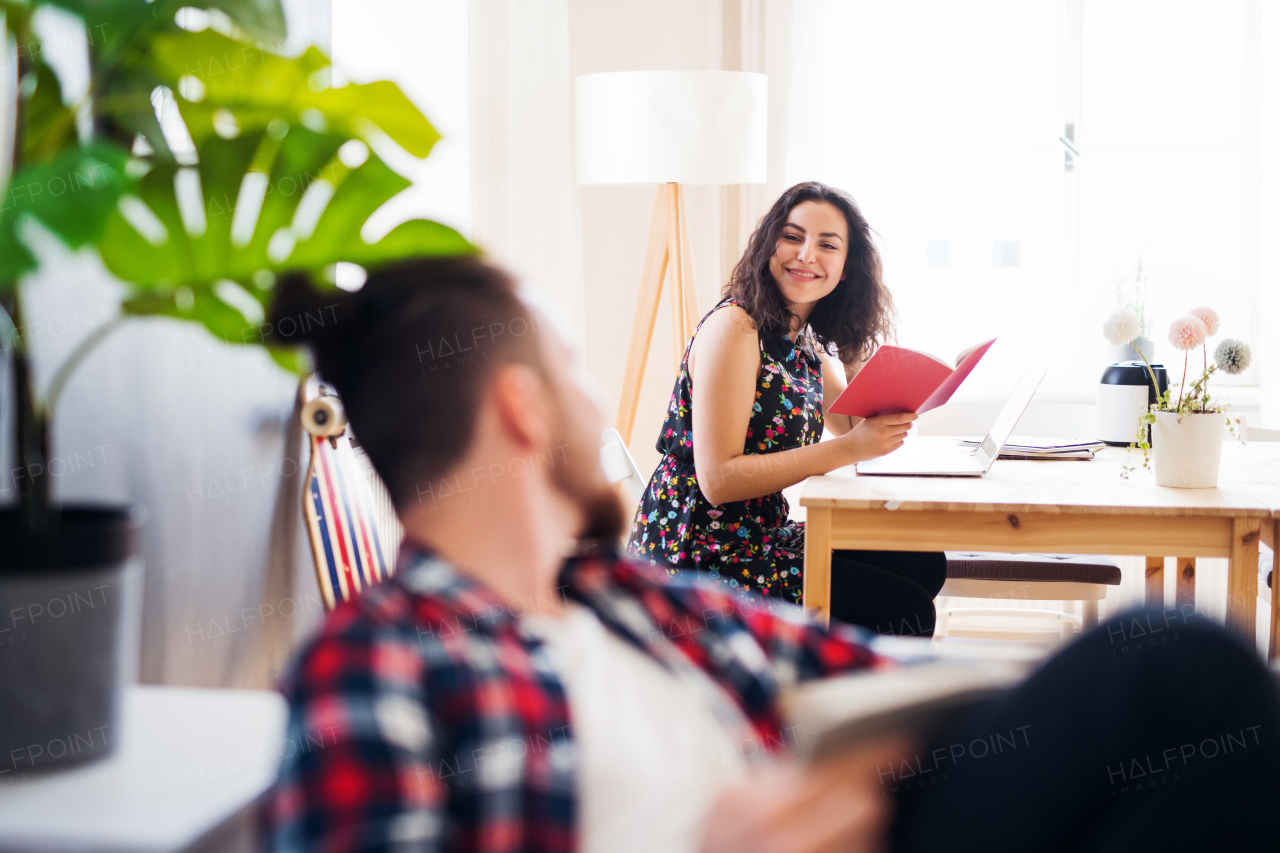 Young friends relaxing indoors, a house sharing concept.