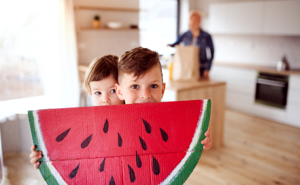 Two happy small children playing at home. Copy space.