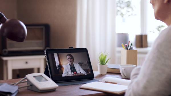 Senior woman having an online consultation with doctor. Lockdown concept.