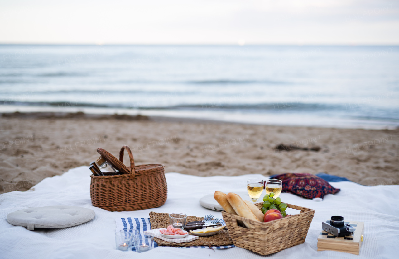 A beach picnic with schripms, beer, candles.