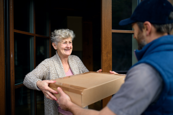 Man courier delivering parcel, corona virus and quarantine concept.