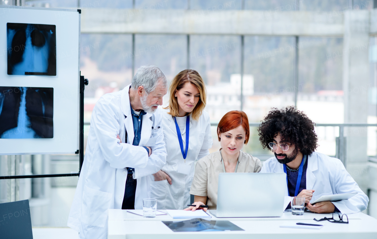 A group of doctors talking about corona virus on conference.