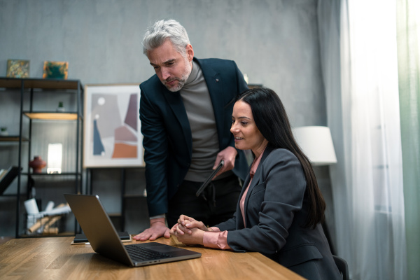 A business team working together on project in office