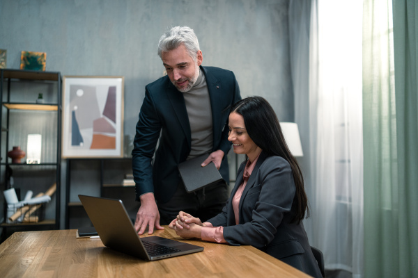 A business team working together on project in office