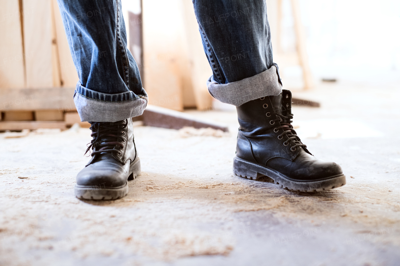 Small business of a young woman. Legs of an unrecognizable woman worker.