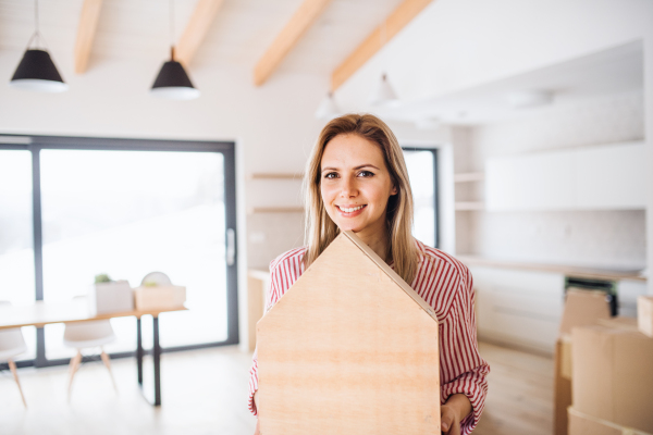 A young woman moving in new home, a concept. Copy space.