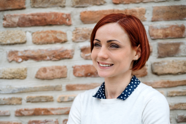 A portrait of young business woman standing outdoors. Copy space. Start-up concept.