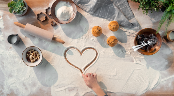 A flat lay top view of baking ingredients, desktop and hobby concept.