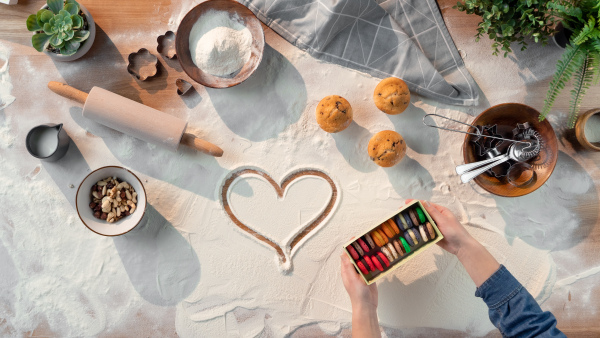 A flat lay top view of baking ingredients, desktop and hobby concept.