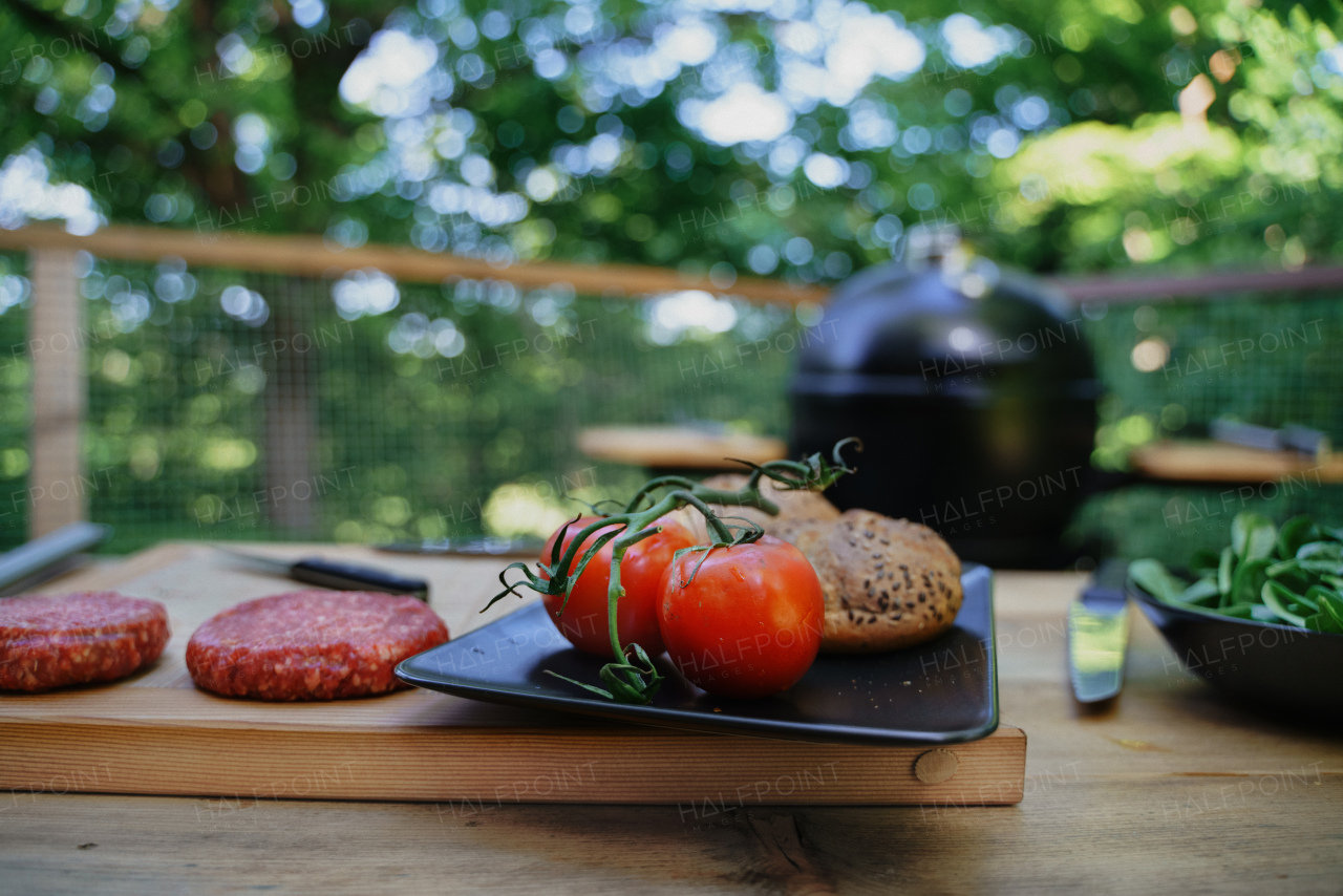 A raw minced hamburger meat with prepared for grilling