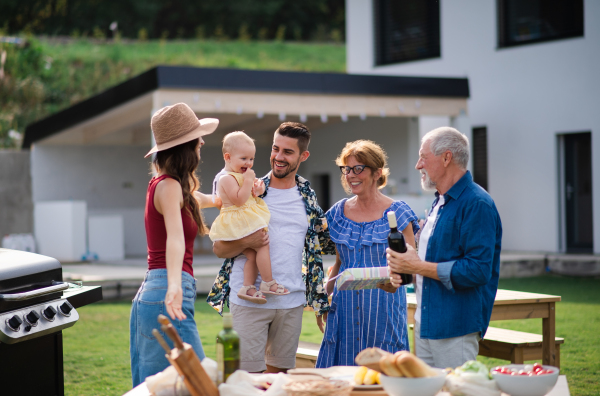 A portrait of happy people outdoors on family birthday party.