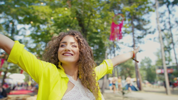 A front view of beautiful young woman at summer festival