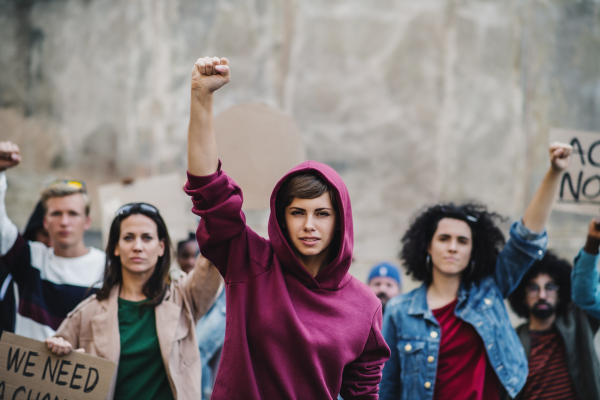 Portrait of group of people activists protesting on streets, demonstration and coronavirus concept.