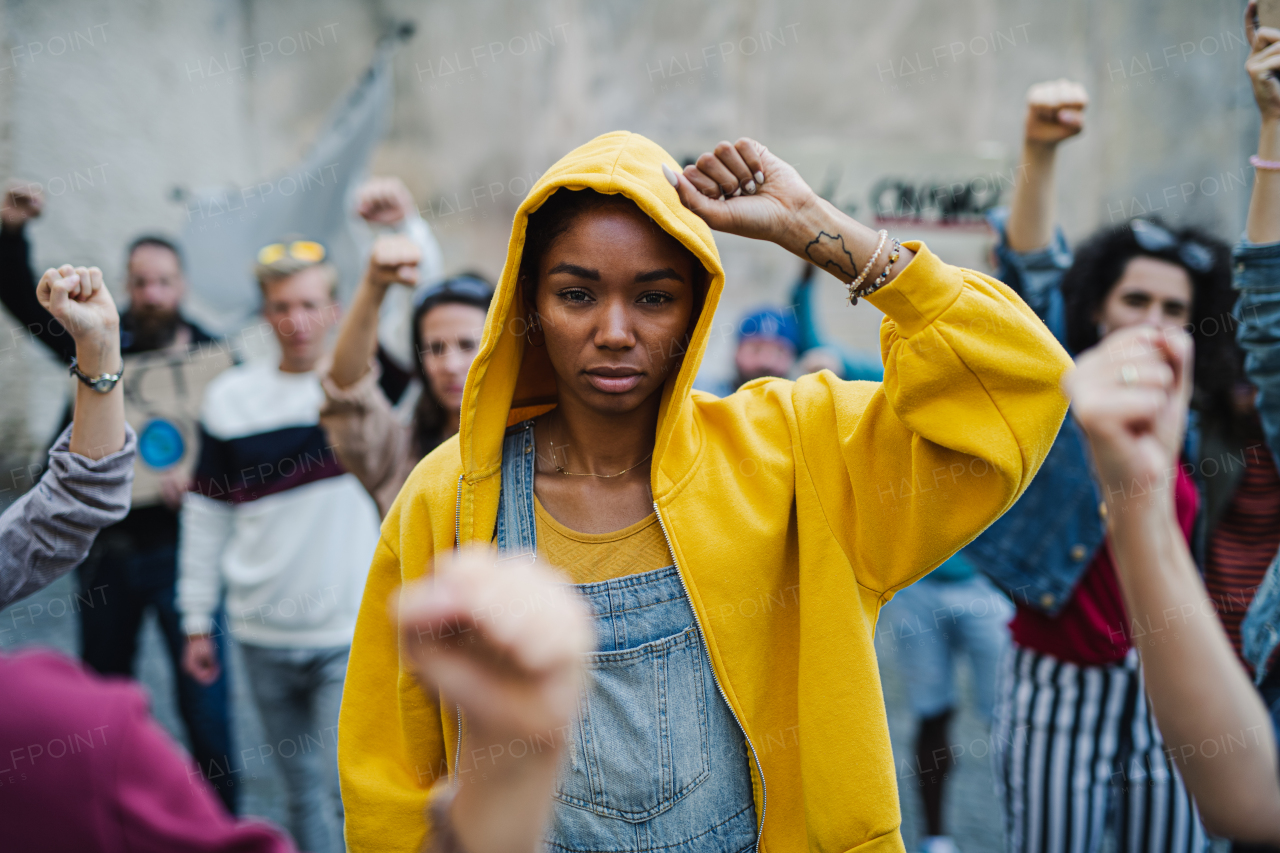 Front view of group of people activists protesting on streets, BLM demonstration and coronavirus concept.