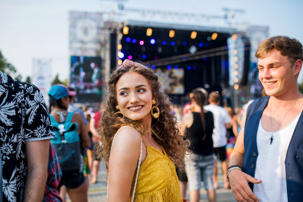 A group of cheerful young friends at summer festival.