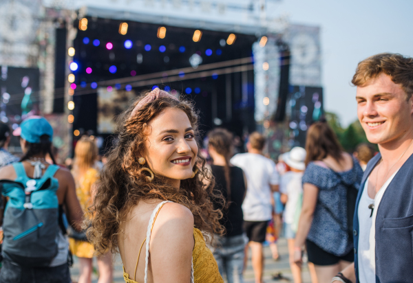 A group of cheerful young friends at summer festival.