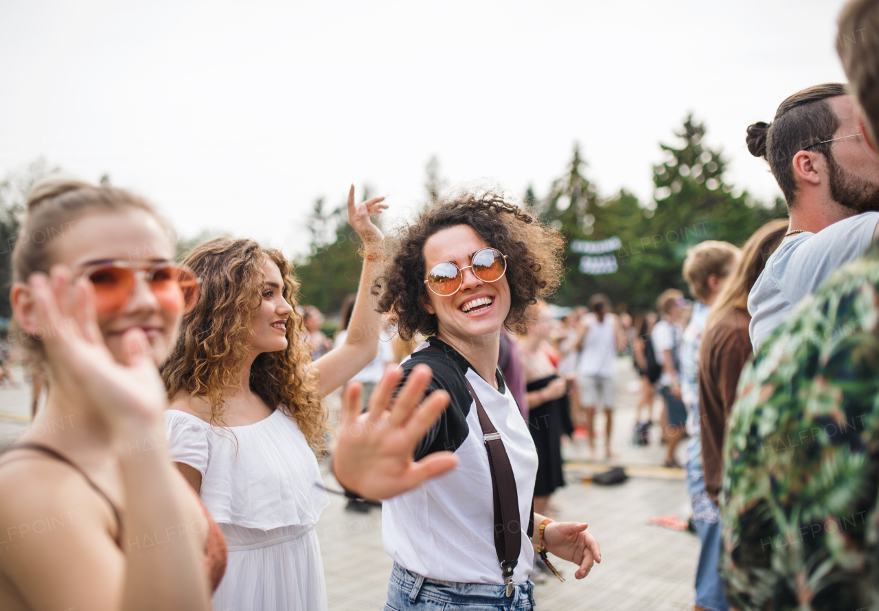 A group of cheerful young friends at summer festival.