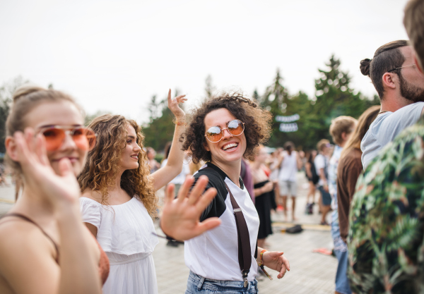 A group of cheerful young friends at summer festival.