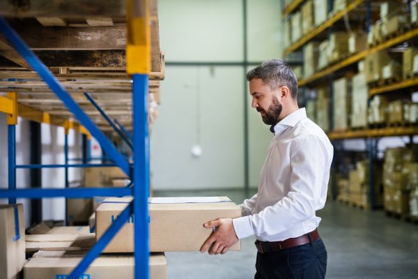 Handsome male warehouse worker or a supervisor.