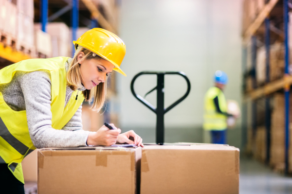 Young workers working together in a warehouse.